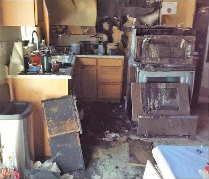 kitchen damaged by fire after a faulty wiring on the wall