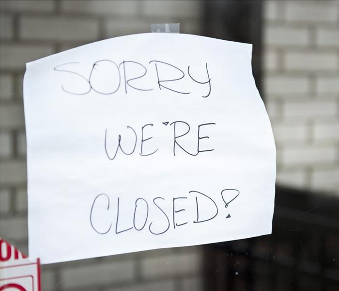 Poster stating "sorry we're closed"