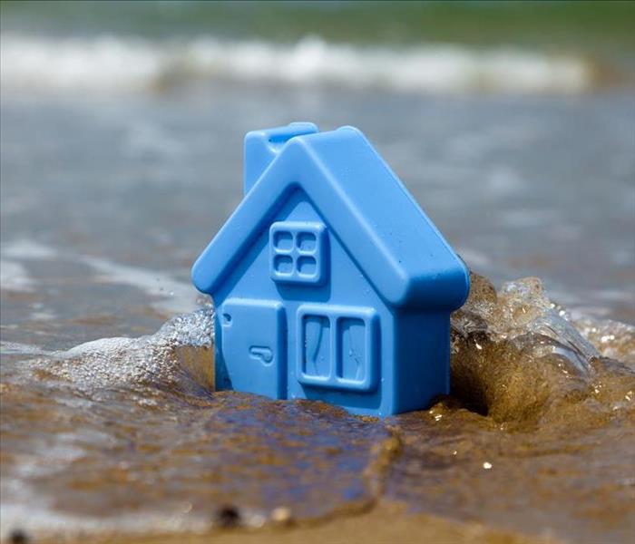 Blue home in the water.