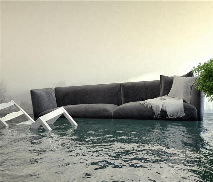 Image of a couch floating in a flooded living room