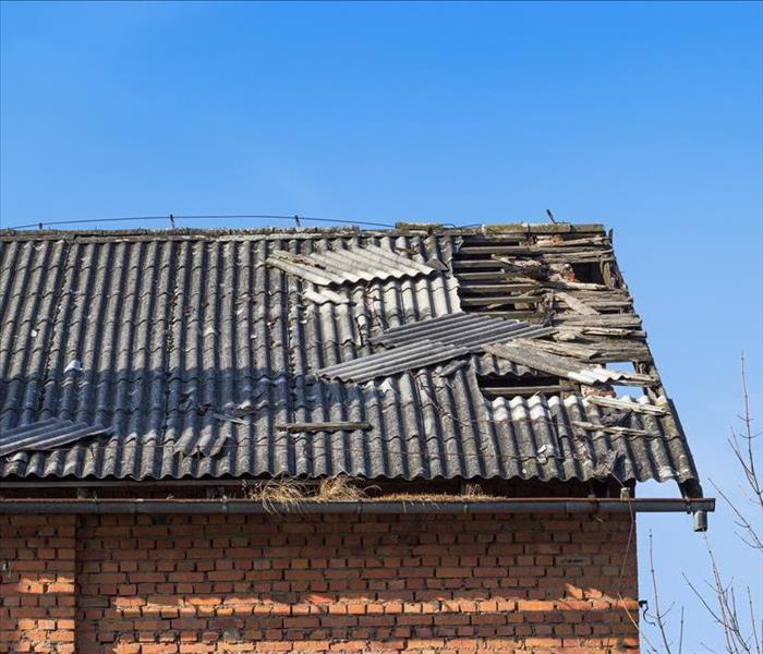 Image of a roof with holes and damaged.